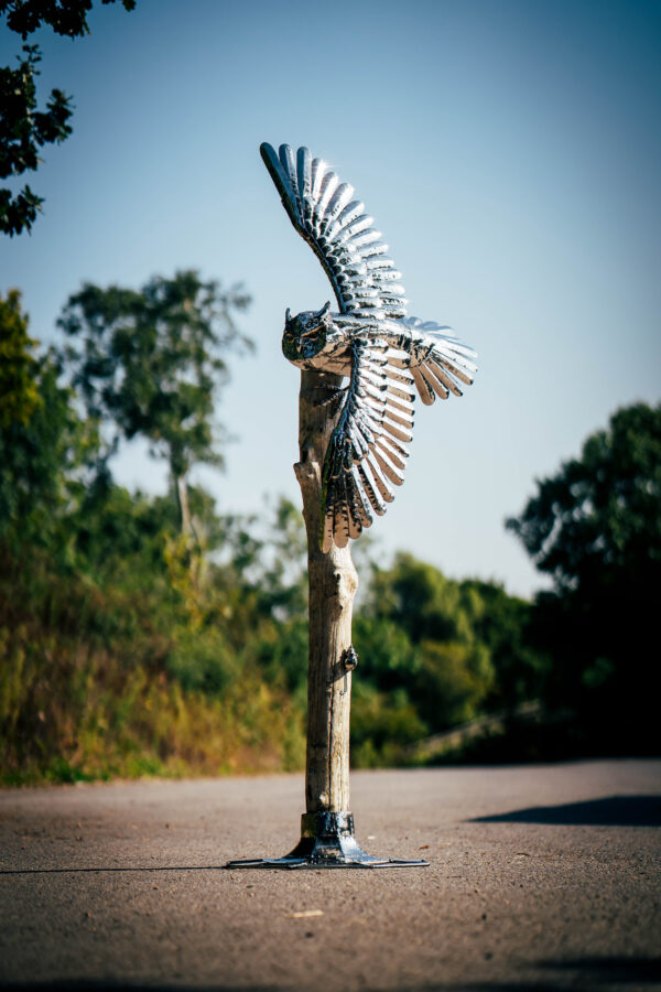 Swooping owl garden sculpture in stianless steel.